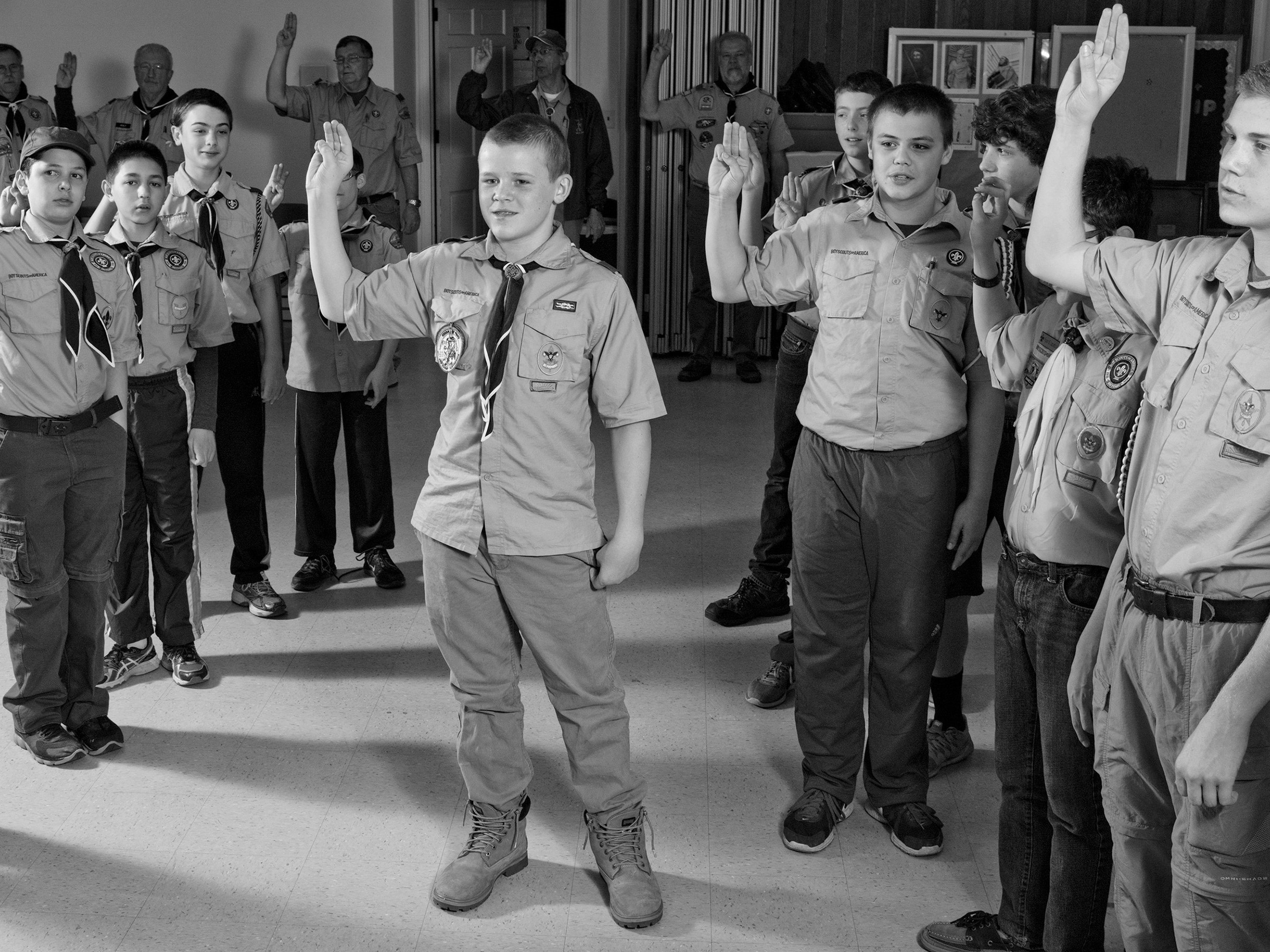 Boy scouts saluting